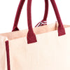 Close-up of the maroon handle and attachment stitching on the Boutique Canvas Tote