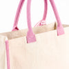 Close-up of the pink handle and attachment stitching on the Boutique Canvas Tote